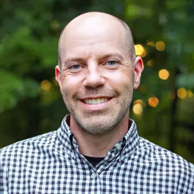 Headshot of U N E employee Bob Kennedy